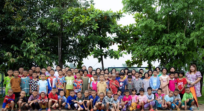 happy children in front of a building